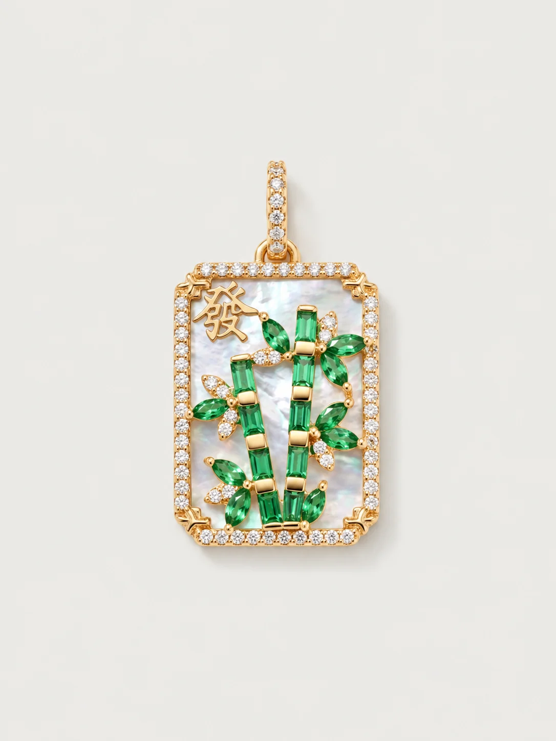 The Bamboo pendant — baguette tsavorite bamboo on a mother-of-pearl mahjong tile framed in diamonds